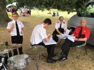 The Musical Director Oversees the Filing of Music Folders at The Avenue Day Nursery Fete - July 2018